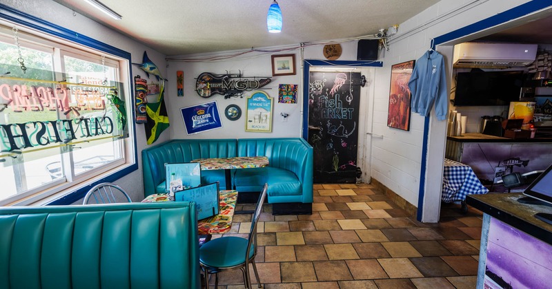 Interior, tables, chairs and blue sofas