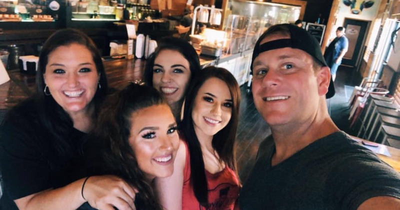 Owner taking a selfie with guests