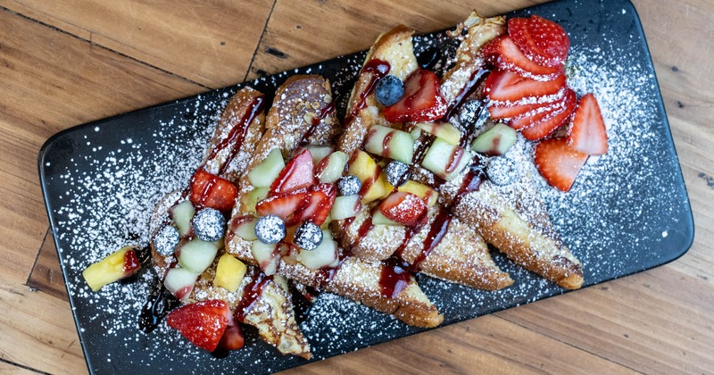 French toast topped with berries and syrup