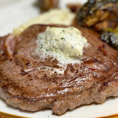 Brandt Beef Ribeye, mashed potatoes, fried Brussels sprouts, compound butter.