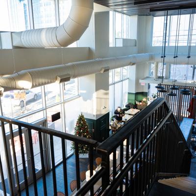 Interior, a view of  the first floor from the top of the stairs.