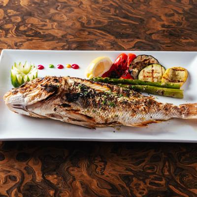 Grilled golden snapper  served with grilled veggies.