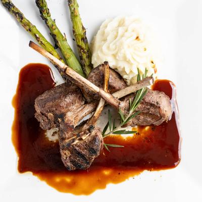 Grilled lamb chops with asparagus and mashed potatoes in Madeira wine sauce.