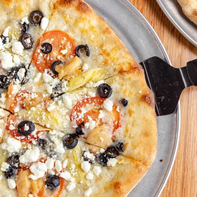 Greek pizza with olives and feta.