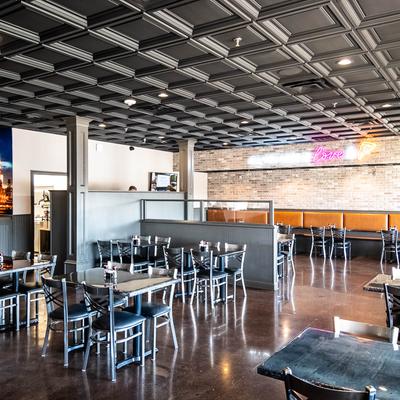 Restaurant's interior with tables and chairs.