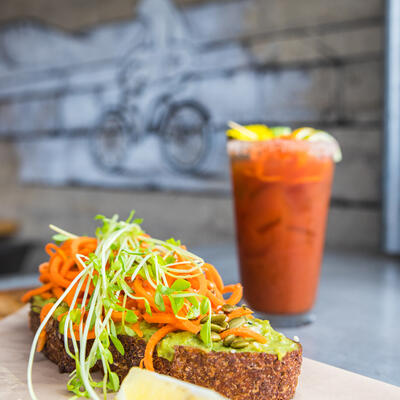 Sandwich with mixed vegetables, red cocktail on the side