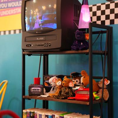Collection of toys and a CRT TV.
