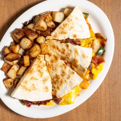 Quesadillas served with home fries.