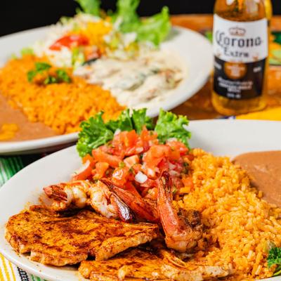 Grilled pork chops and shrimp, with rice, beans, and pico de gallo.