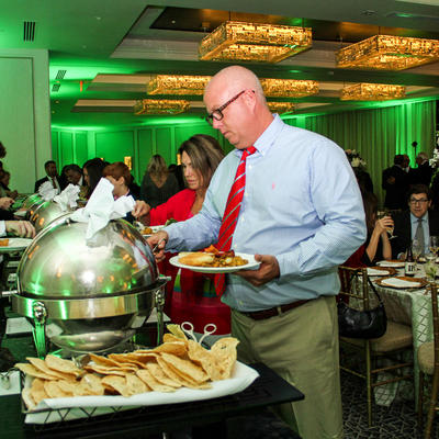 Gentleman grabbing food from the heater