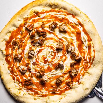 Buffalo chicken pizza with ranch dressing.
