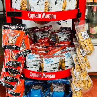 Branded rack stocked with various packaged snacks.
