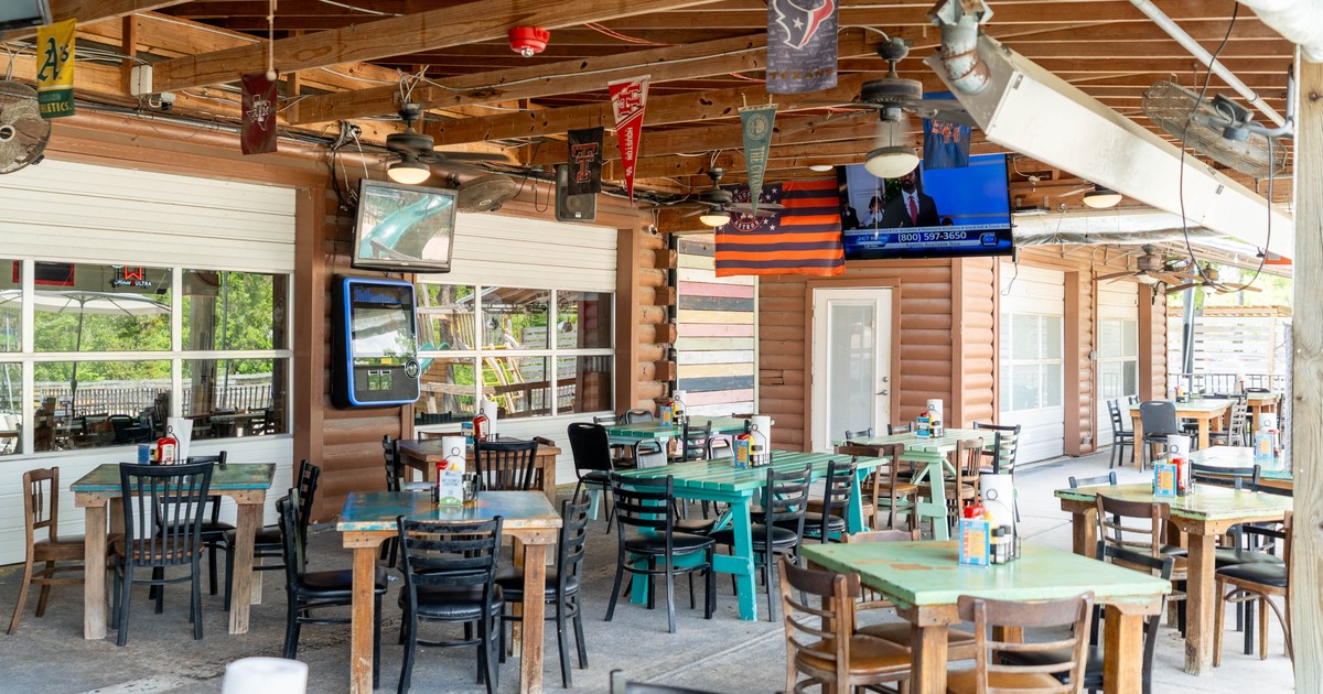 Covered patio with tables and chairs