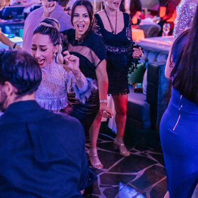 Guests enjoying the live performance at Calle Dragones.