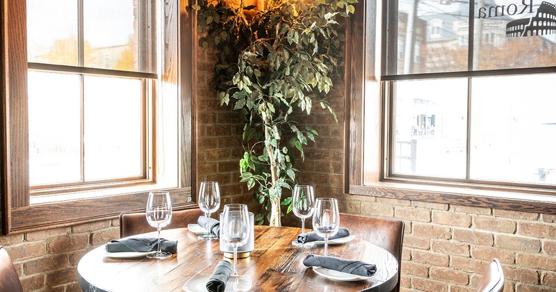 Restaurant interior, dining table set for five guests