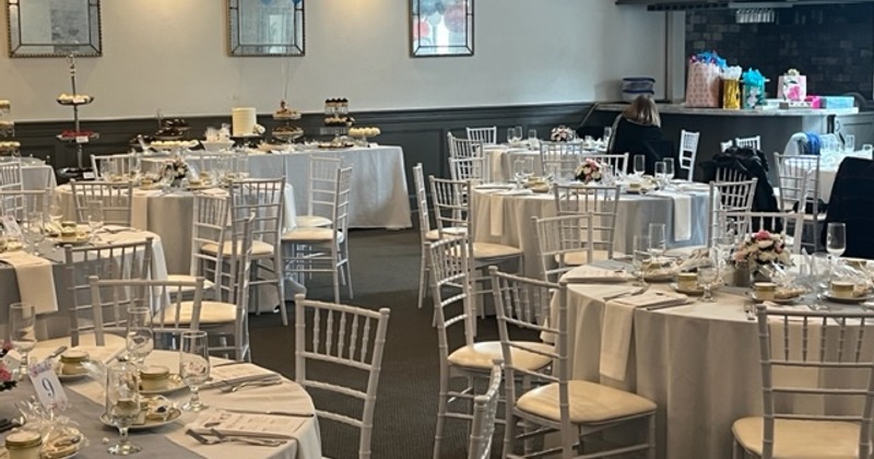 Interior, dining tables ready for guests