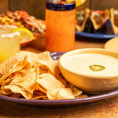 Tortilla chips and cheese dip.