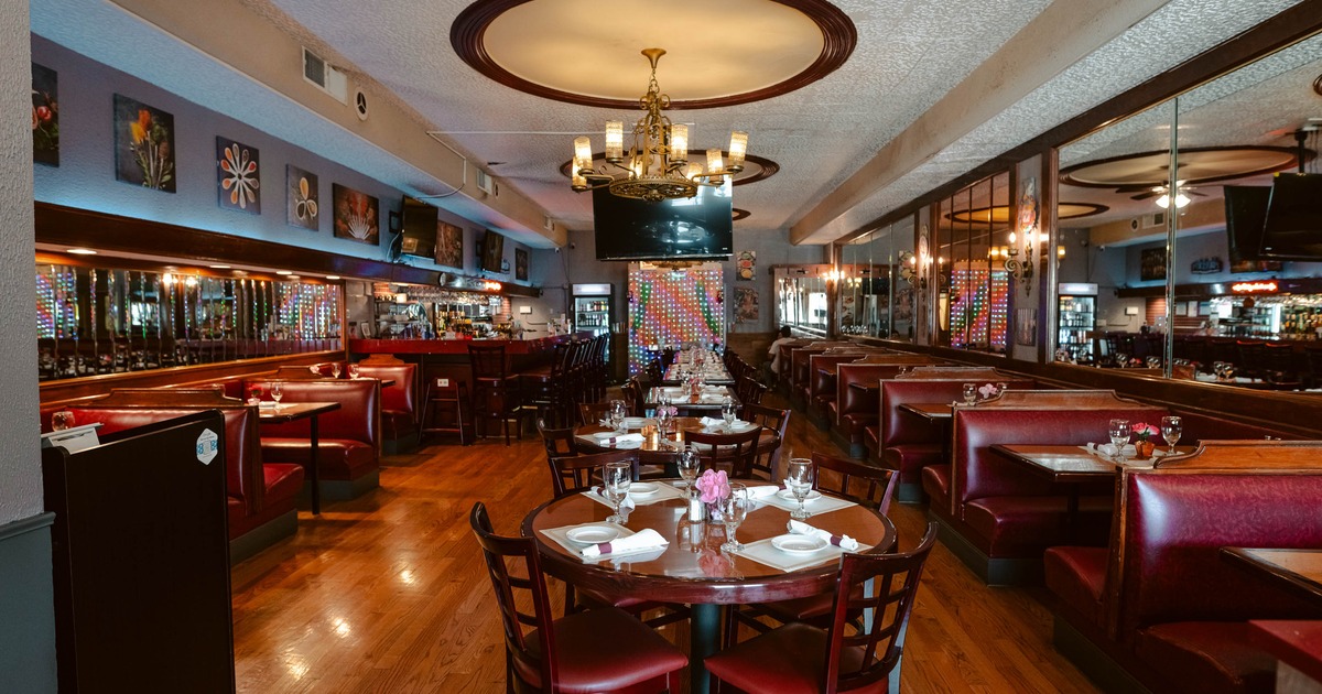 Interior, dining area with tables, chairs and restaurant booths