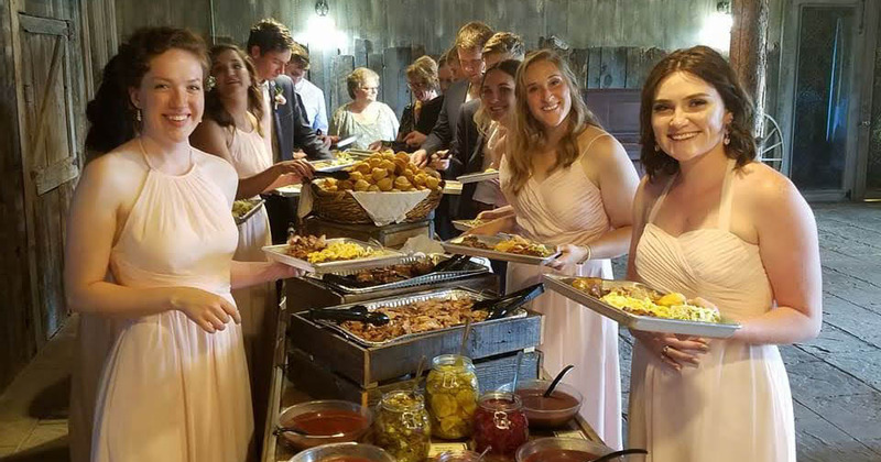 Celebration party, guests around catering food