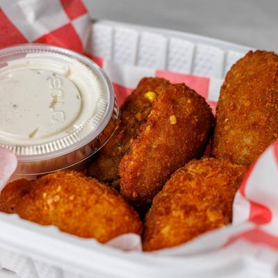 Jalapeno Poppers with a side of ranch sauce.
