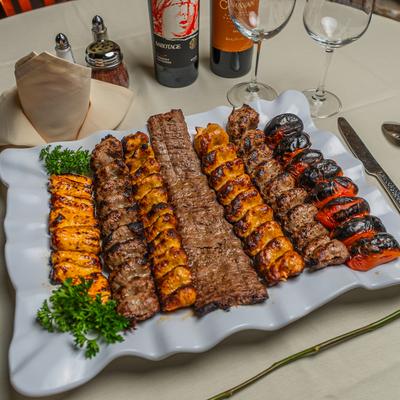 Assorted kebab platter served with wine.