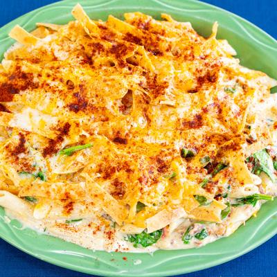 Mac and Cheese, with bacon, spinach, Southwestern cream sauce, paprika, and tortilla strips.