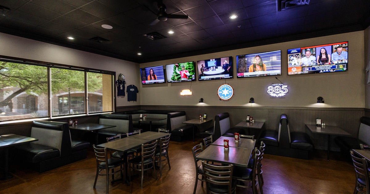 Interior, seating area with a booths, tables and chairs