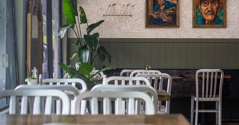 Interior, tables and chairs in seating area