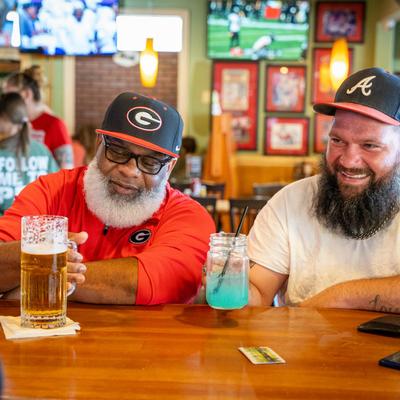 Customers having drinks at the bar.