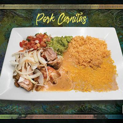 Pork Carnitas served with rice, beans, guacamole and pico de gallo.