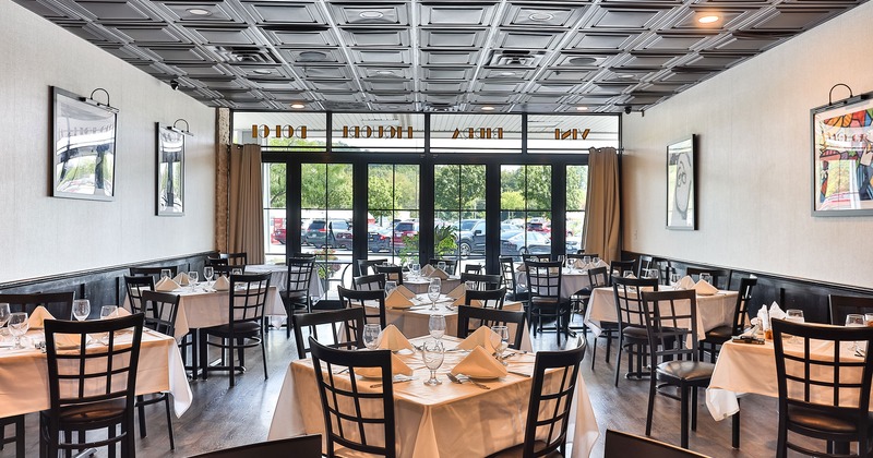 Restaurant interior, dining room with set tables
