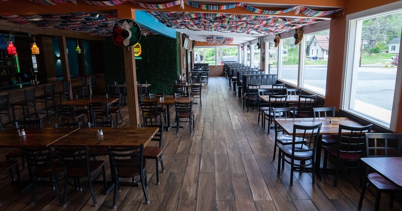 Spacious interior dining area with wooden tables and chairs