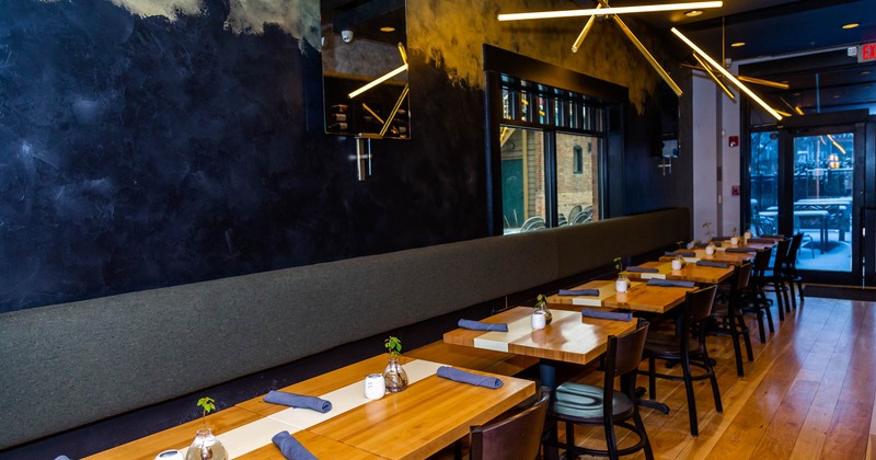 Interior, lined up tables waiting for guests