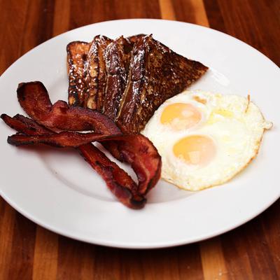 Brioche French Toast, with fried eggs, and bacon.