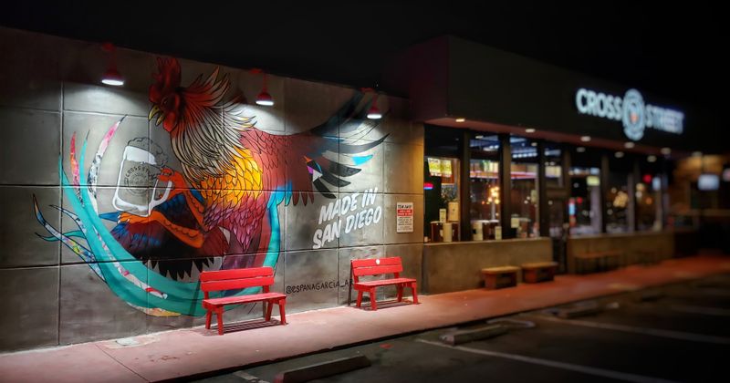 Exterior at night, mural on the restaurant's wall