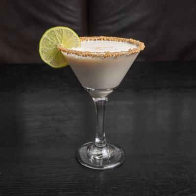 Key Lime Pie Martini cocktail, garnished with lime wheel.