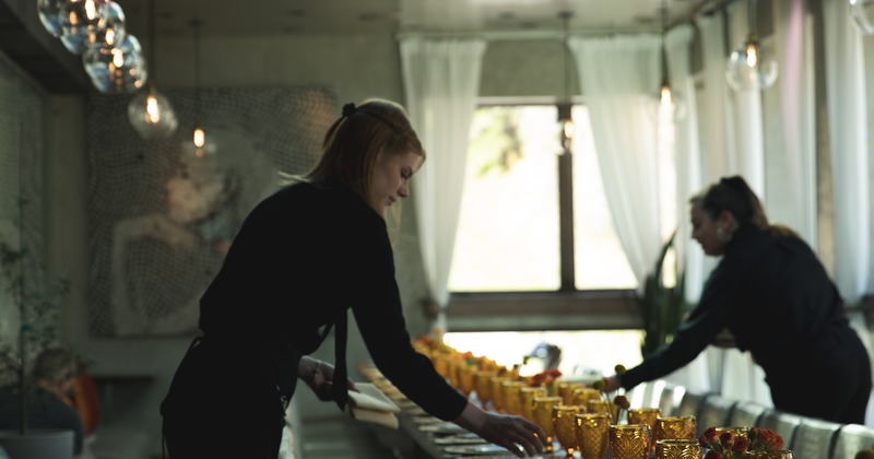 Employees setting tables