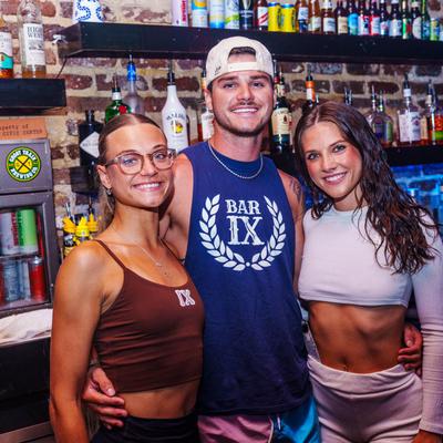 People standing and hugging for a photo.