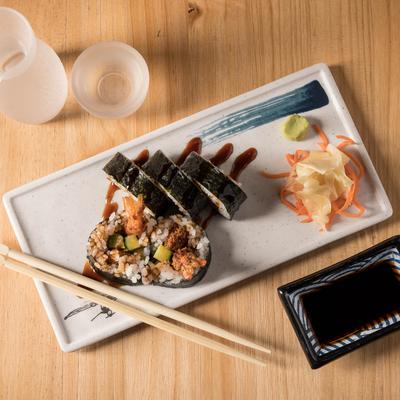 Shrimp tempura roll and sake, top view.