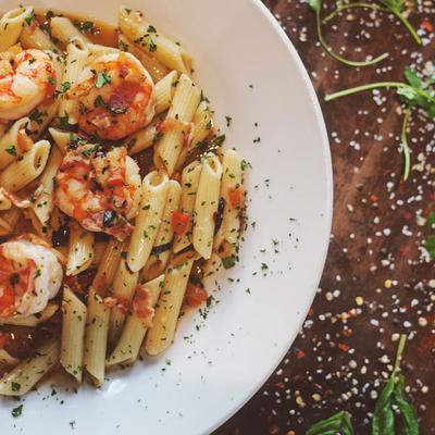 Penne tossed with sauteed shrimp, tomatoes, bacon, vodka and crushed red pepper