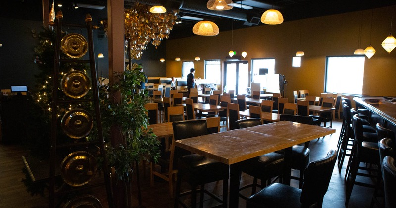 Interior, wide view, tables and chairs ready for guests