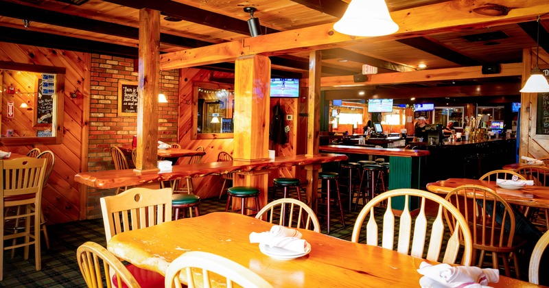 Restaurant interior featuring wooden decor and a cozy atmosphere