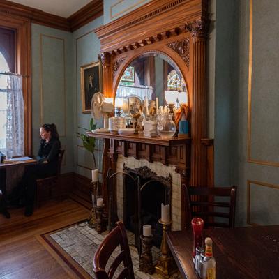 Interior, fireplace in a seating room.