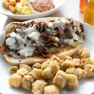Philly cheese steak with fried okra bites.