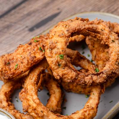 Hand-breaded onion rings.