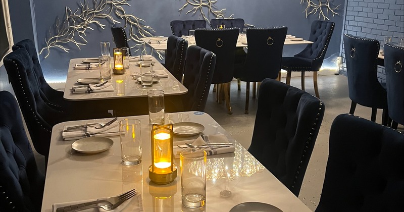 Elegant and cozy interior dining area with set tables ready for guests