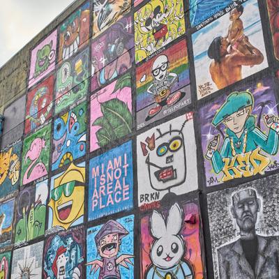 Wall mural with separate art panels created by various artists.