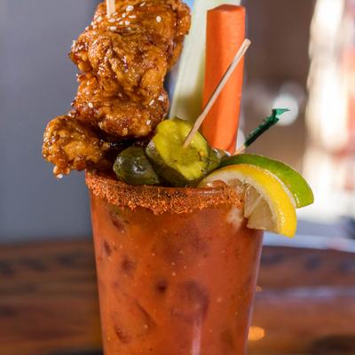 Breckenridge Vodka Bloody Mary with jumbo bone in wings and other garnishes.