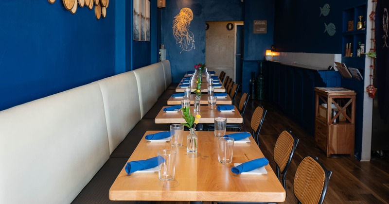 Interior, tables set for guests in dining area