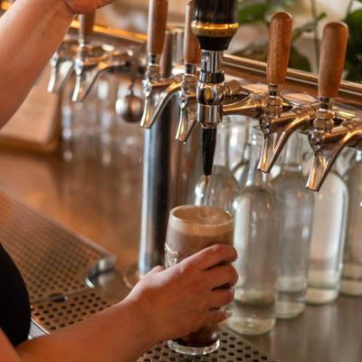 Bartender pouring draft beer.